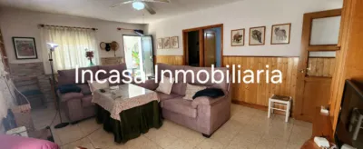 Chalet for sale in Los Pinos de Valverde del Camino, in a beautiful area surrounded by nature. The property features a spacious living room with a fireplace, three double bedrooms, a bathroom with a shower tray, a kitchen with access to the barbecue area, a front terrace, a swimming pool, and a large plot with olive trees, fruit trees, a chicken coop, and a spacious garage. photo 6